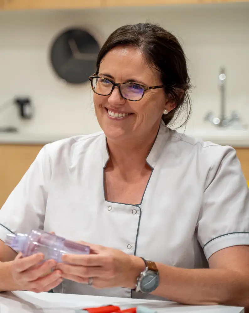 Pharmacist holding a product