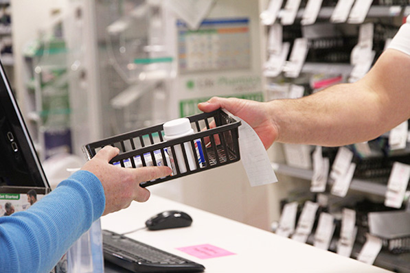 Handing over prescription to customer-2